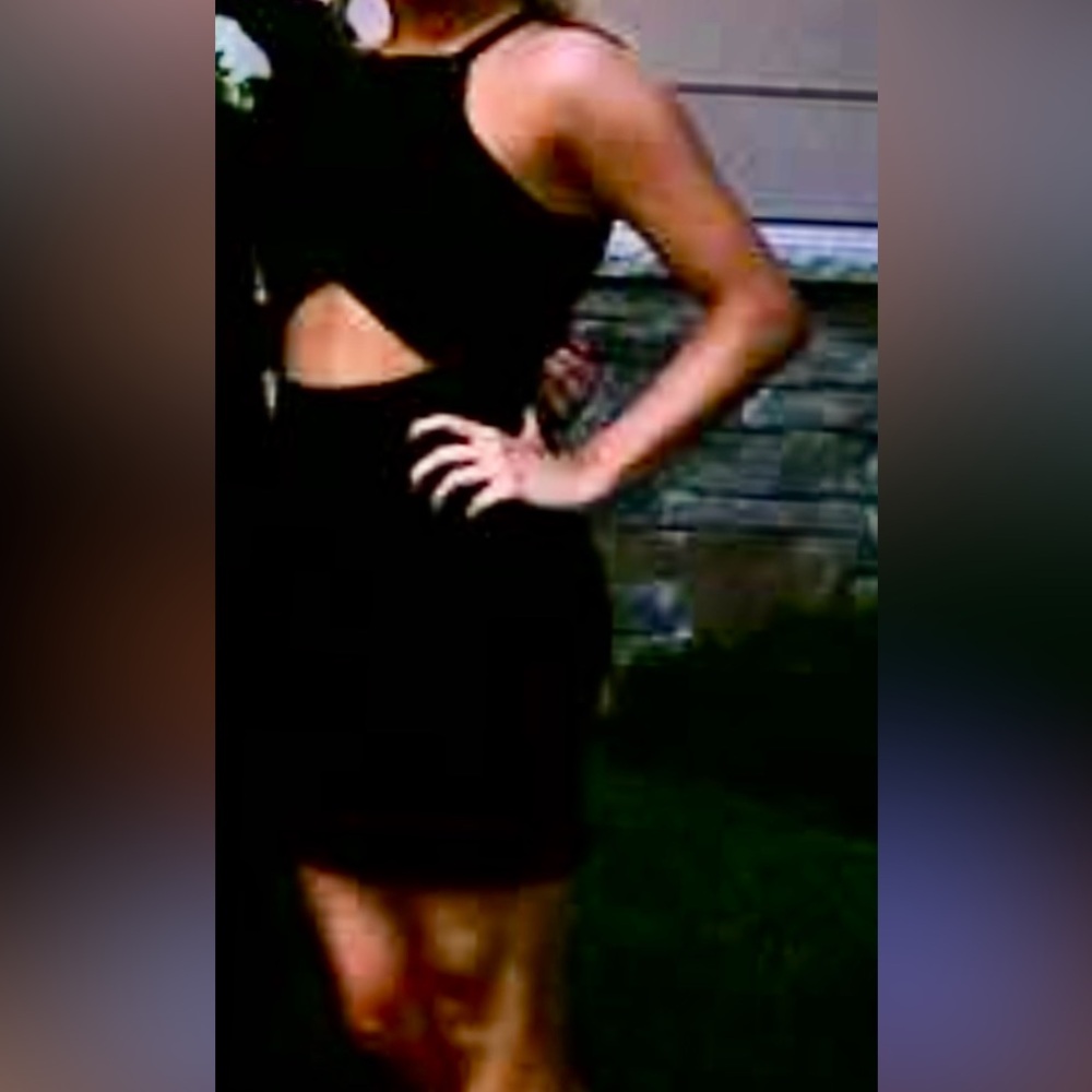 Little black dress. Size medium, with some stretch, cut out in the middle